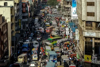 Matatus and pedestrians on a busy central Nairobi street